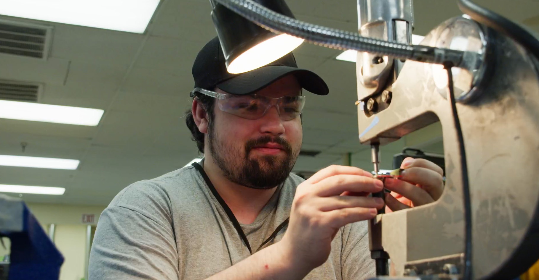 Man operating machining equipment