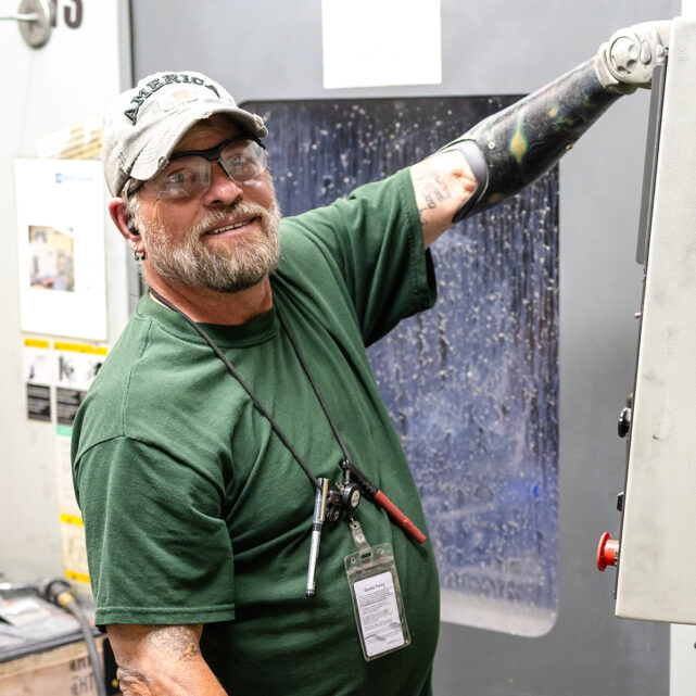 Smiling man running machine