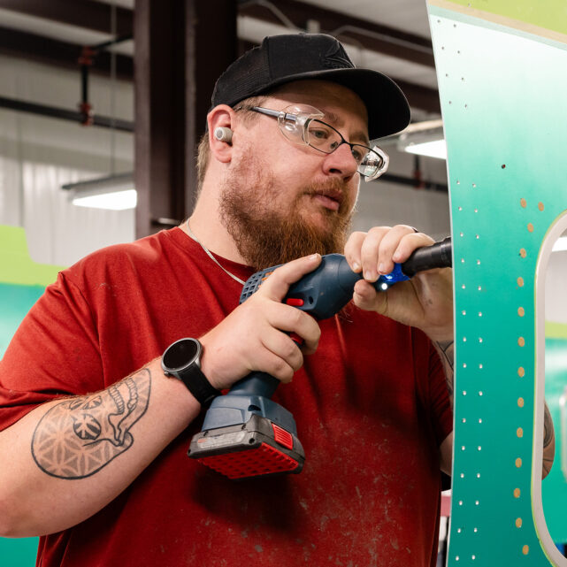 Man working on airplane, aviation manufacturing